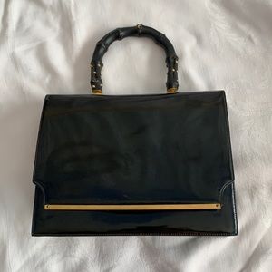 70s black patent leather envelope purse With studied leather bamboo handle.